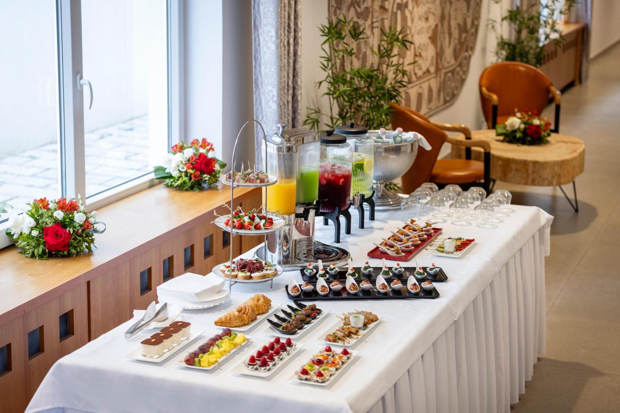 Rogner Hotel Tirana Exterior photo A buffet table with a selection of hors d'oeuvres