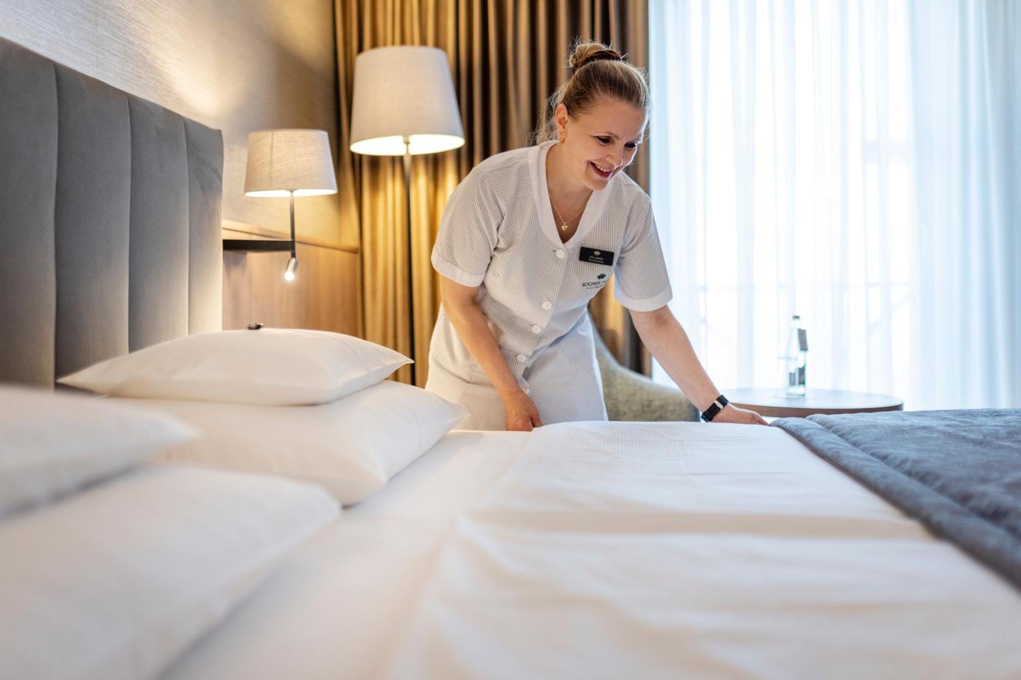 Rogner Hotel Tirana Exterior photo A chambermaid making a bed