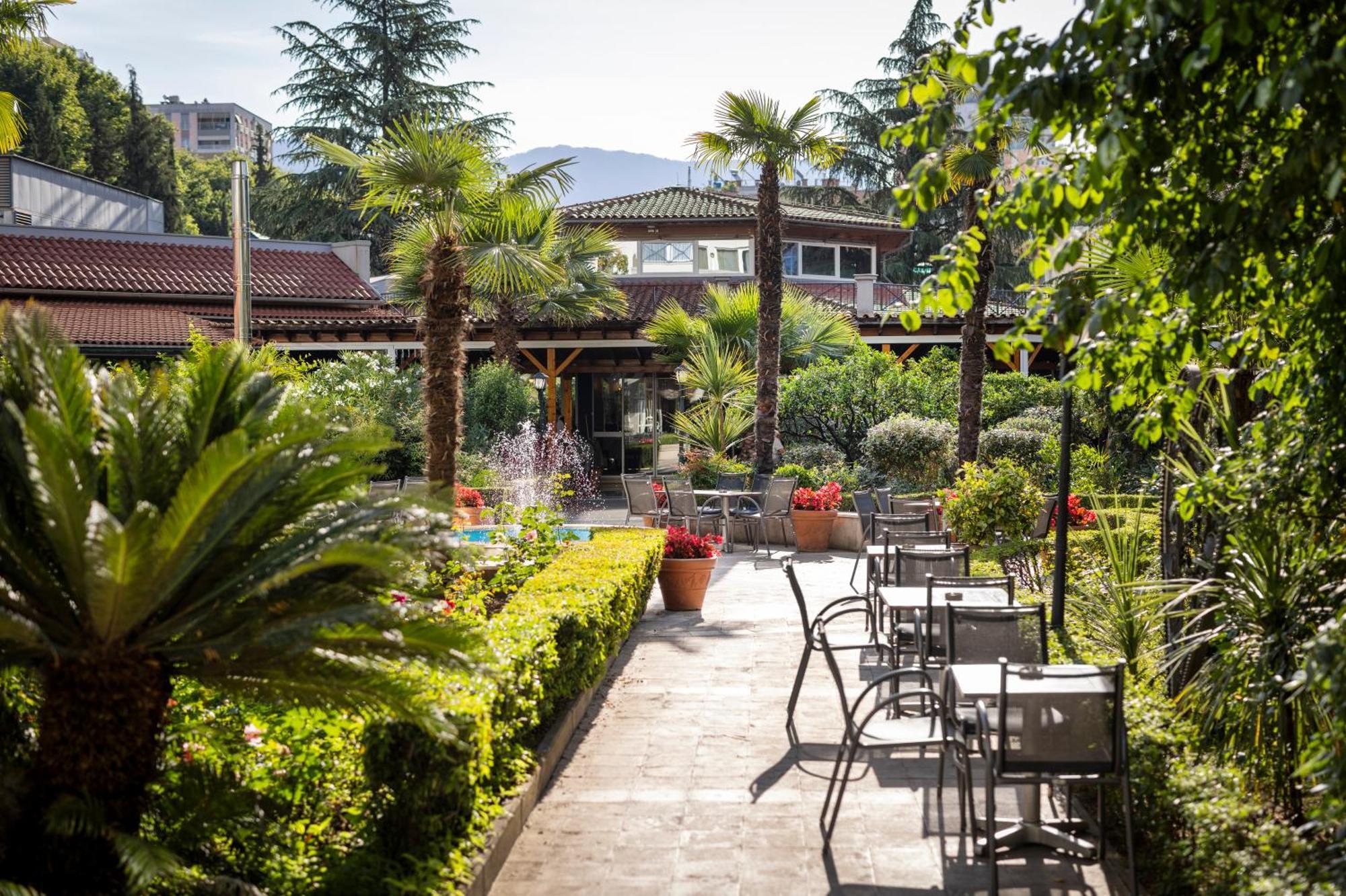 Rogner Hotel Tirana Exterior photo The hotel's garden